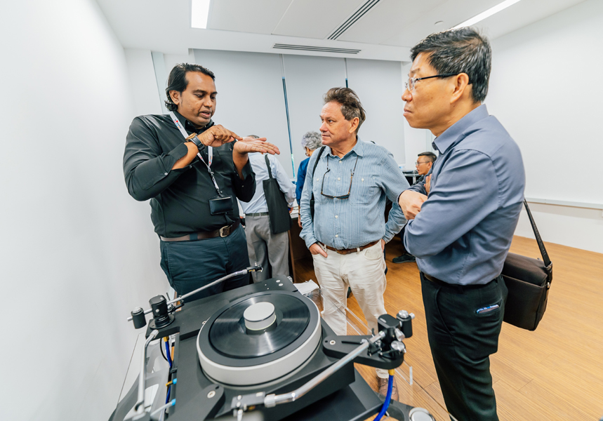 Senior AV Preservation Officer Shanker Thangavellu elaborates  on the challenges of cleaning vinyls and shellacs to visitors. Images courtesy of the National Archives of Singapore.