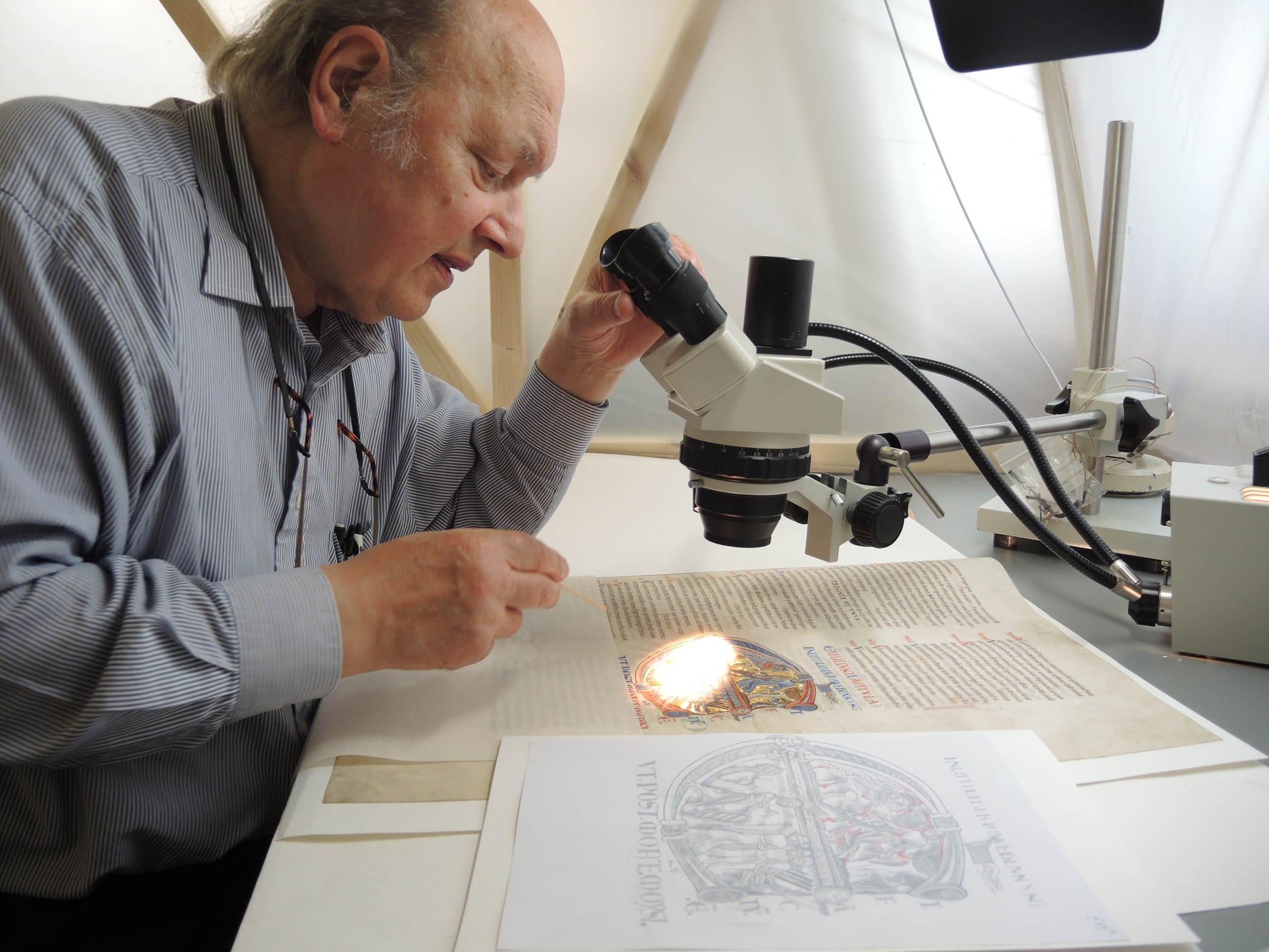 Christopher Clarkson examining a manuscript. Image Copyright Jane Eagan / Winchester Cathedral